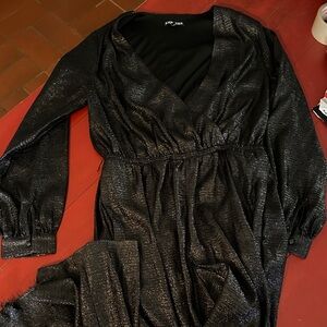 Express M Black Romper with Shimmering Detail, lined, one hem damaged as shown.